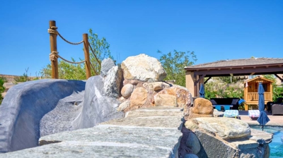 Small archway over the exit of the pool slide Photo