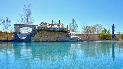 Outdoor pool with pool slide Photo