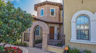 Home Exterior with Brick Archway Photo