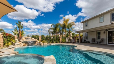 Closer View of Pool with Waterfall and Spa Photo