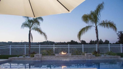 Pool with Lit Fire Pit Photo