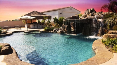 A glowy sunset embodied by a blue pool Photo