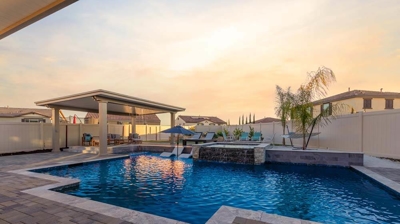 Outdoor blue pool and patio during the morning light Photo