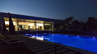 Sleek outdoor pool adorned with mesmerizing light accents. Photo