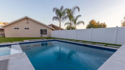 Backyard with custom swimming pool and spa Photo