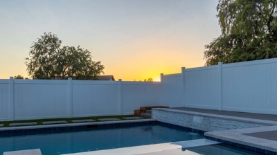 Backyard swimming pool and spa at dusk Photo