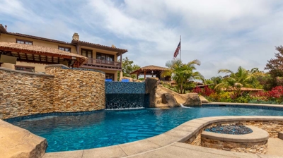 Sunken poolside patio seating area with firepit Photo