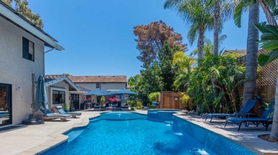 View over patio with custom swimming pool Photo