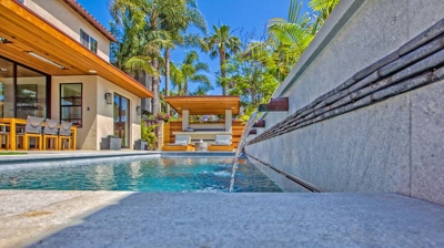 Rectangle pool design with patio in background Photo