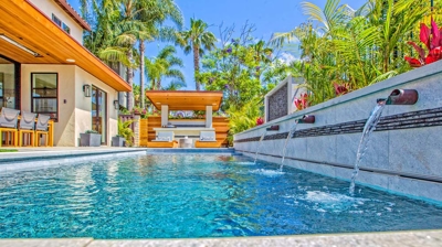 Rectangle pool design with patio in background Photo