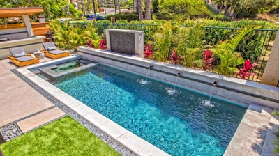 Rectangle pool design with patio in background Photo