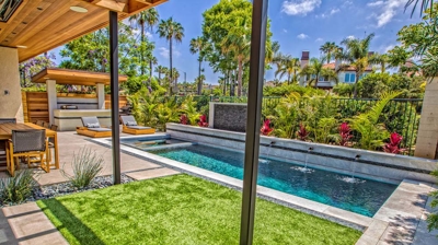 Rectangle pool design with patio in background Photo