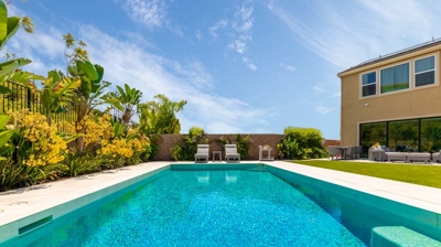 Rectangle pool design with jacuzzi in outdoor oasis Photo