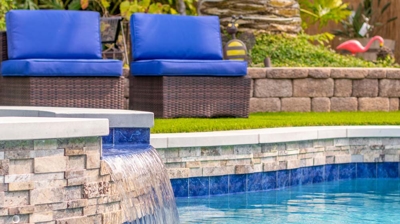 Water tricking in from jacuzzi into pool Photo