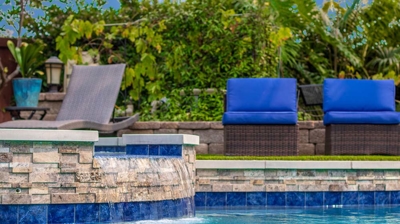 Water tricking in from jacuzzi into pool Photo