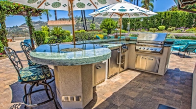 Grilling and lounging area of outdoor patio Photo