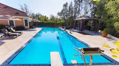 Large rectangular pool with diving board Photo