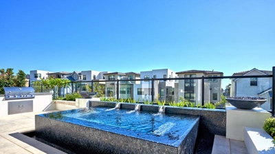 A sun-soaked rooftop sanctuary with spa amenities. Photo