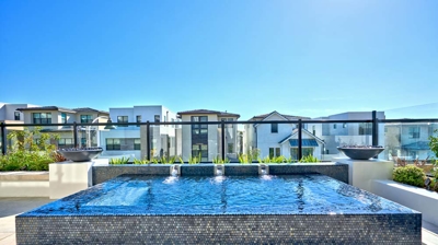 Contemporary daytime escape with rooftop spa. Photo