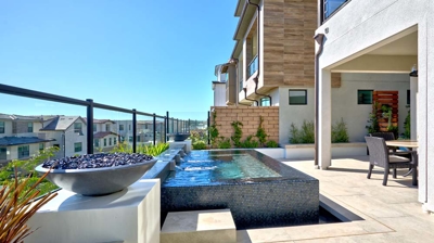 Daytime relaxation zone with a rooftop spa. Photo