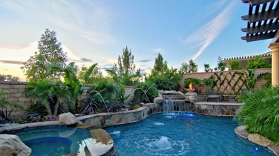 Beautiful backyard pool with attached spa Photo