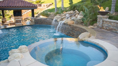 Backyard spa attached to pool Photo