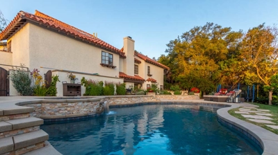 Outdoor pool with attached spa Photo
