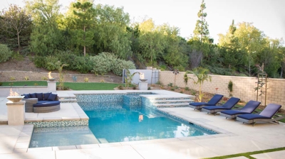 Backyard pool with attached spa Photo