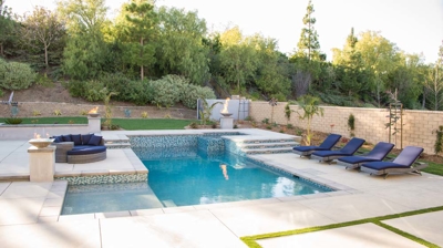 Modern backyard pool with spa Photo