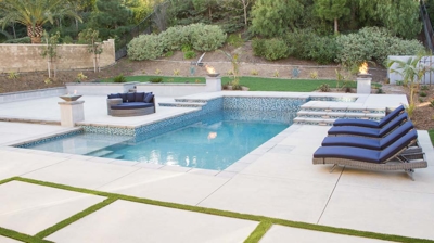 Backyard pool with attached spa Photo