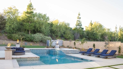 Backyard pool with attached spa Photo