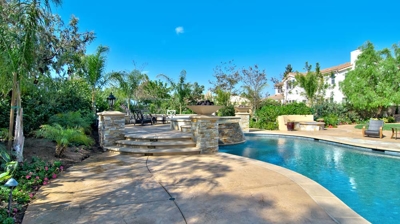 Staircase to attached spa above the pool Photo