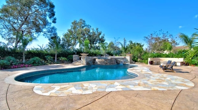 Backyard pool with attached spa Photo