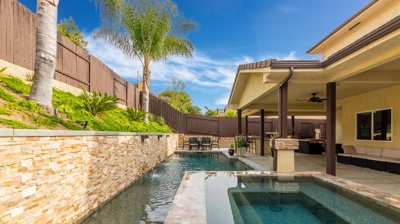 Shaded Pool, Hot Tub, and Patio Photo