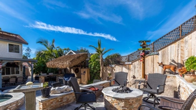 Tiki-inspired outdoor seating with colorful cushions and tropical flair Photo