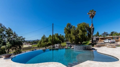 Pool and hot tub with elegant curves shining brightly in the sunlight Photo