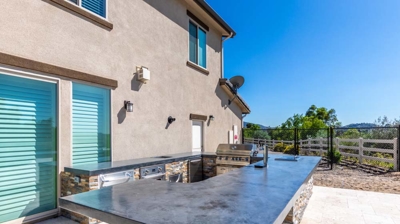 Outdoor cooking haven showcasing a grill, oven, and functional taps for convenient use Photo