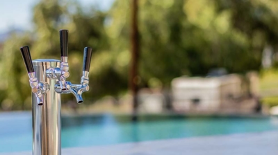 Outdoor cooking paradise with a fully equipped kitchen, including a grill, oven, and taps Photo