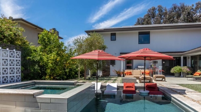 A relaxing day by the rectangular pool and hot tub in a suburban oasis Photo