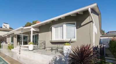 Tranquil oasis: rectangular pool and hot tub in a suburban setting Photo