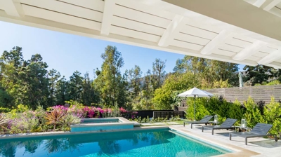 Peaceful backyard haven: rectangular pool and hot tub in a suburban landscape Photo