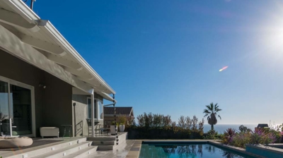 Suburban paradise: rectangular pool and hot tub providing a serene escape Photo