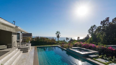 Scenic suburban escape: rectangular pool and hot tub nestled amidst nature Photo