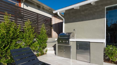Sunny suburban getaway: rectangular pool and hot tub perfect for unwinding Photo