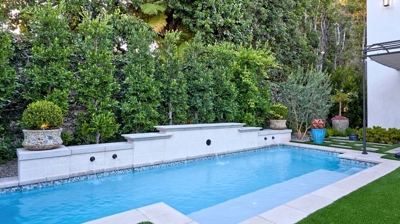 A built in pool with a wading area Photo
