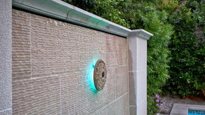 Jacuzzi back wall with stone and a blue light Photo