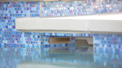 Blue tile around a pool filter Photo