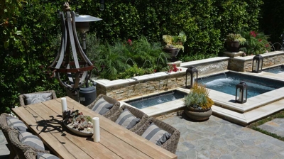A dining table with a spa in the background Photo