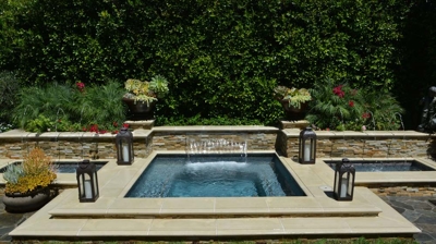 Front view of a spa with two small waterfall basins on the side Photo