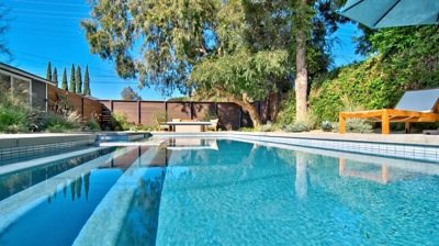 Blue pool water with trees in the background Photo